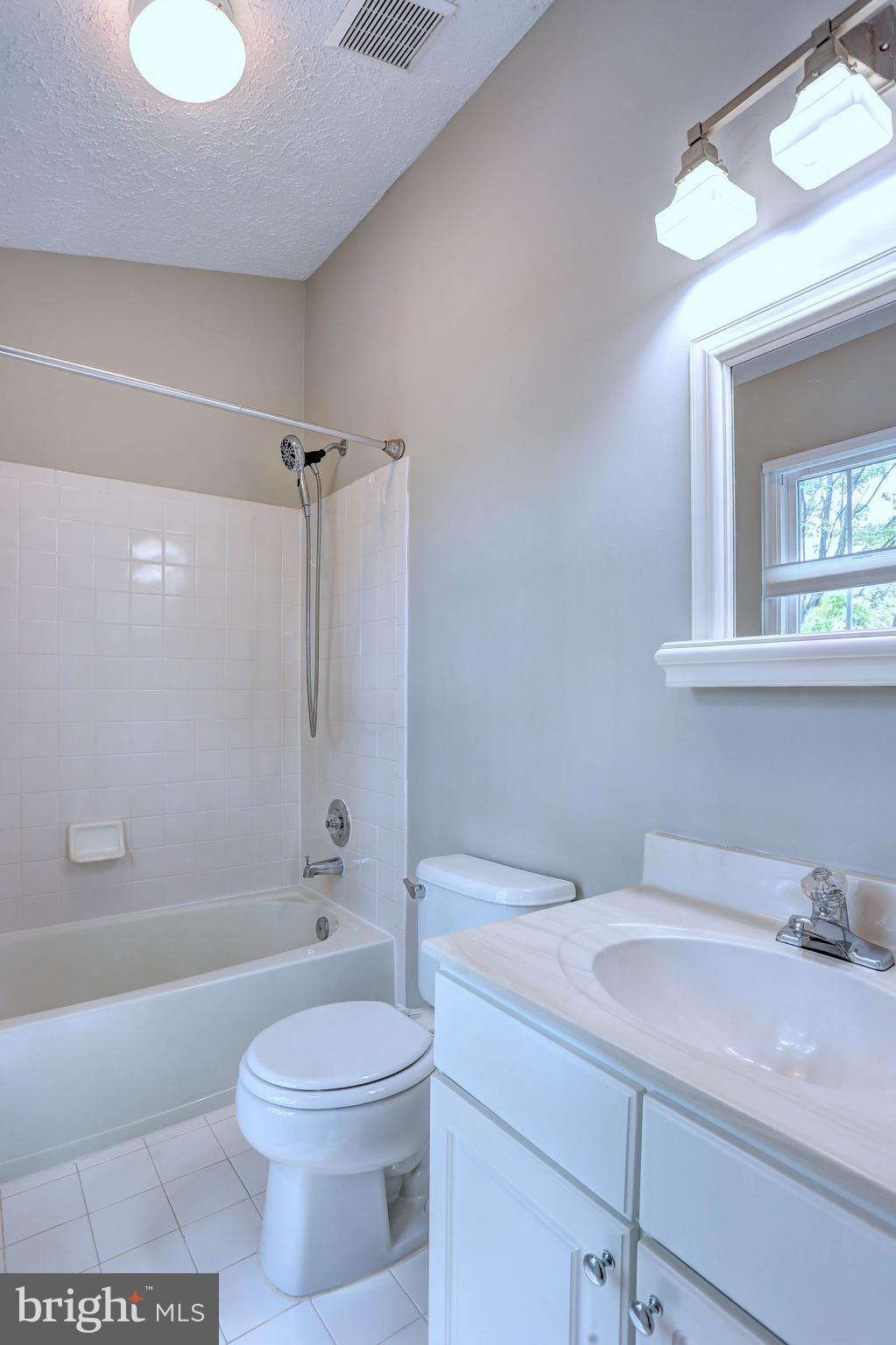 6136 Starburn Path Columbia, MD 21045 - Photo 16 of 35 a bathroom with a sink a toilet and shower