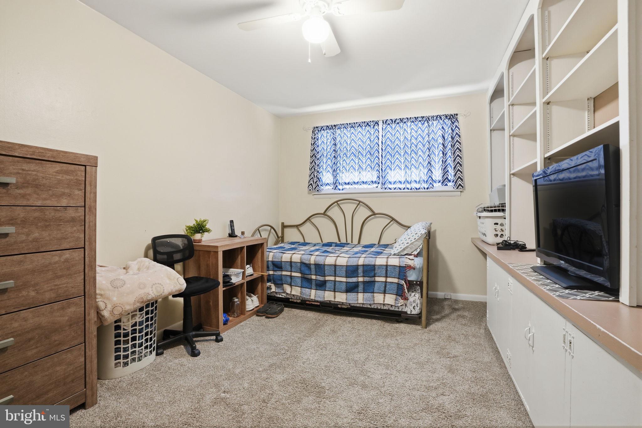 2824 Willits Road Philadelphia, PA 19136 - Photo 11 of 22 a bedroom with furniture and a flat screen tv