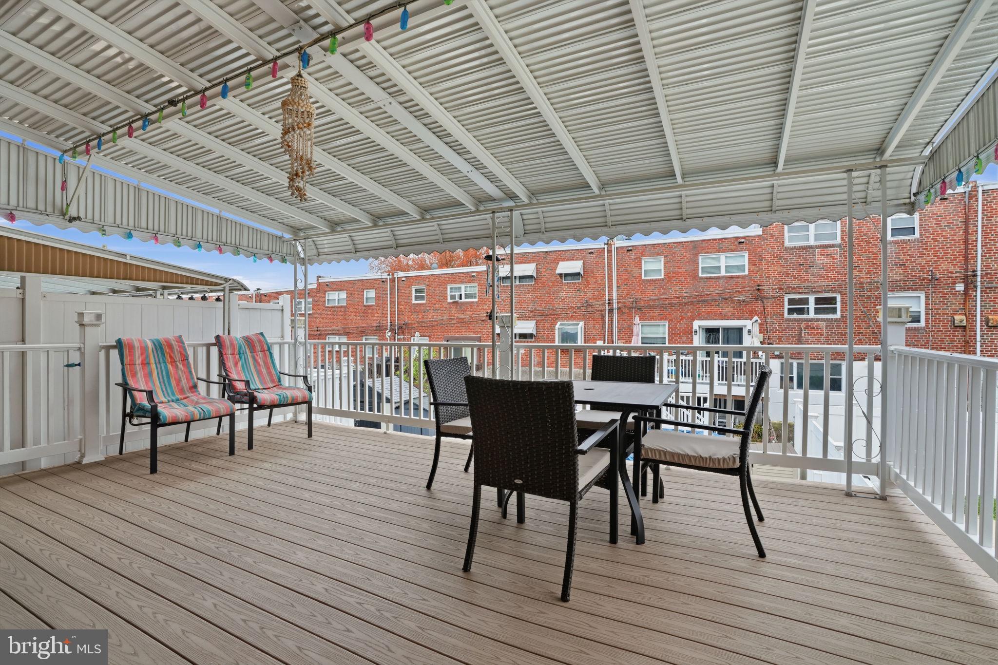 2824 Willits Road Philadelphia, PA 19136 - Photo 16 of 22 a view of a roof deck with table and chairs