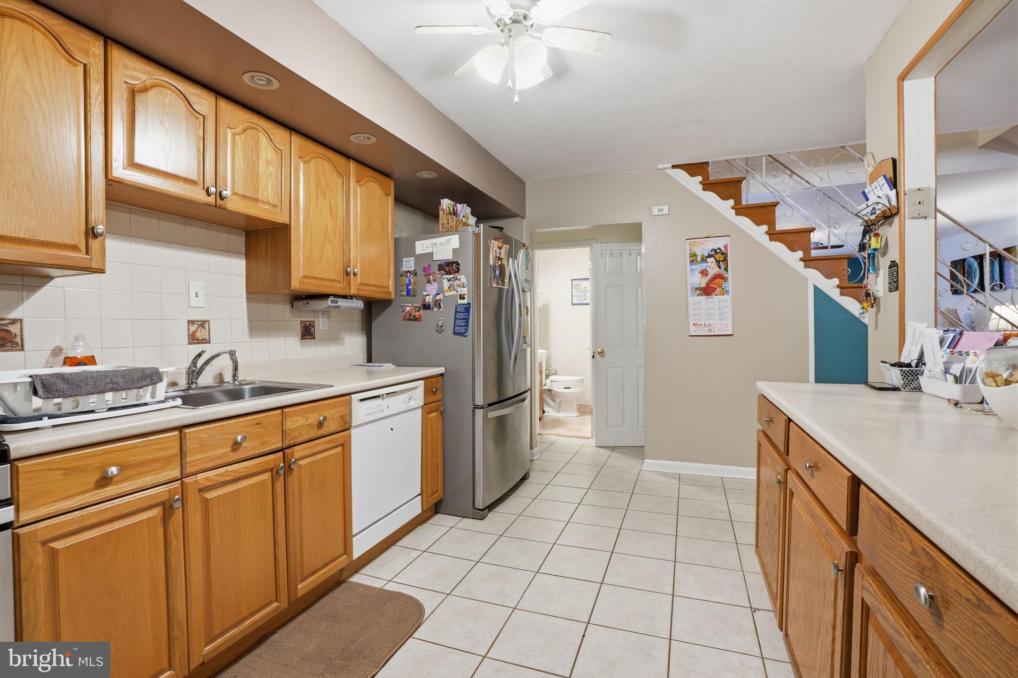 2824 Willits Road Philadelphia, PA 19136 - Photo 8 of 22 a kitchen with stainless steel appliances granite countertop a sink and cabinets