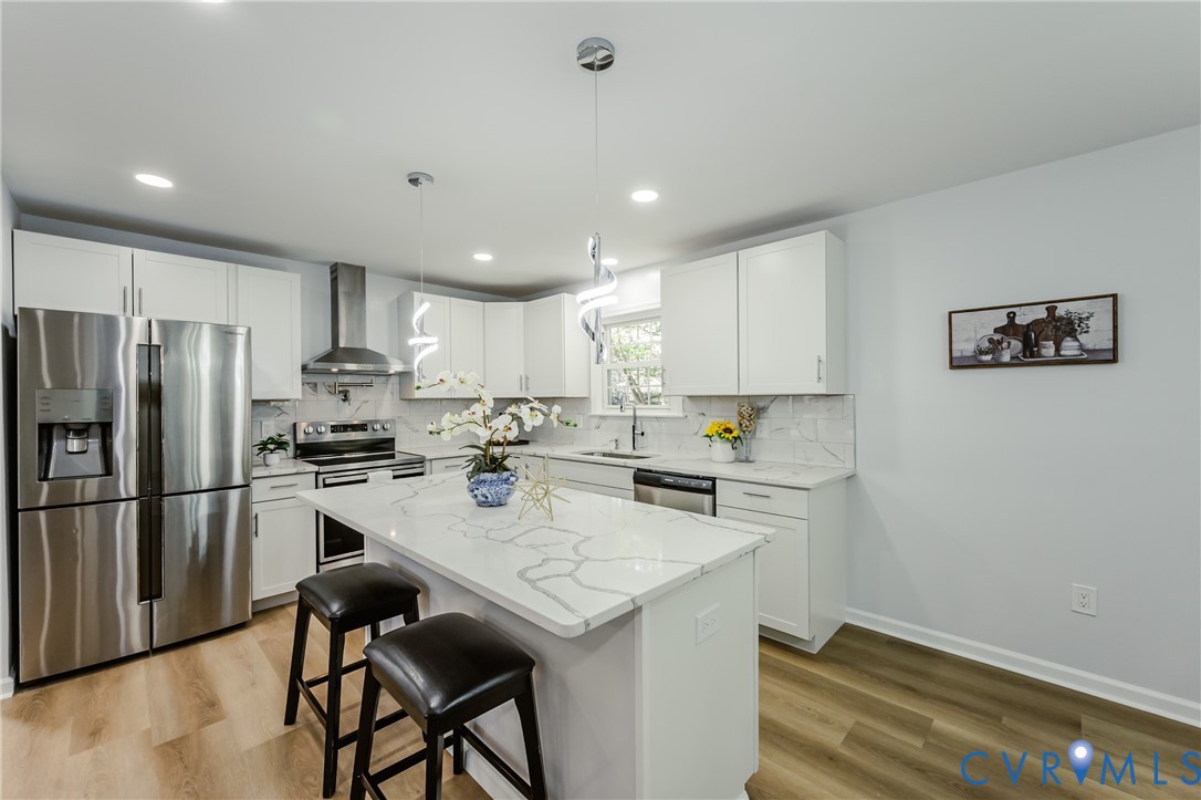 9514 Riddle Road Chesterfield, VA 23832 - Photo 22 of 50 Kitchen with stainless steel appliances, wall chim