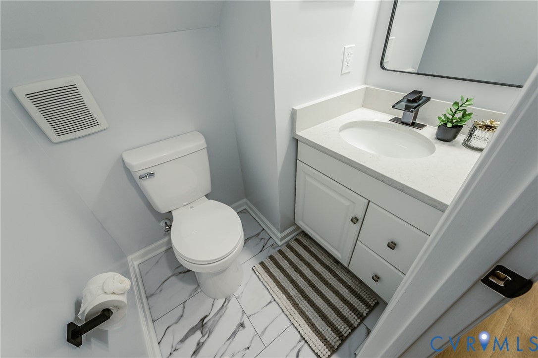 9514 Riddle Road Chesterfield, VA 23832 - Photo 25 of 50 Half bath featuring vanity and light marble finish