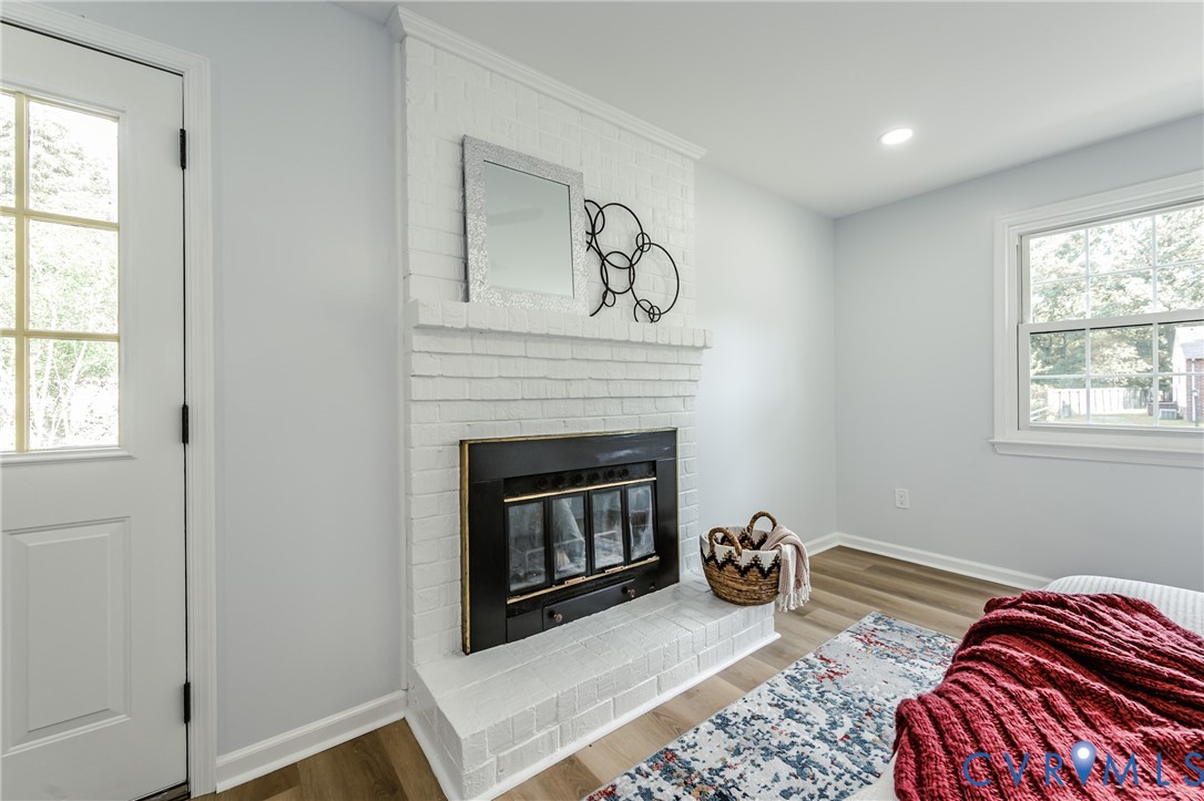 9514 Riddle Road Chesterfield, VA 23832 - Photo 29 of 50 Bedroom with wood finished floors, a fireplace, an