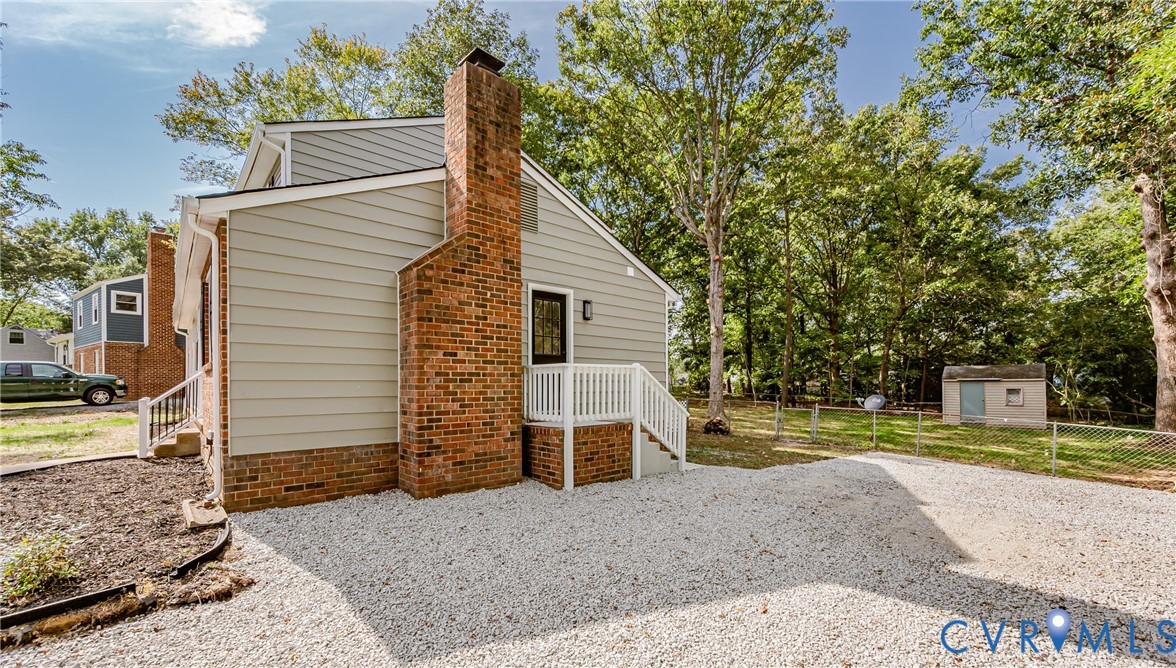 9514 Riddle Road Chesterfield, VA 23832 - Photo 4 of 50 View of home's exterior featuring a chimney and an