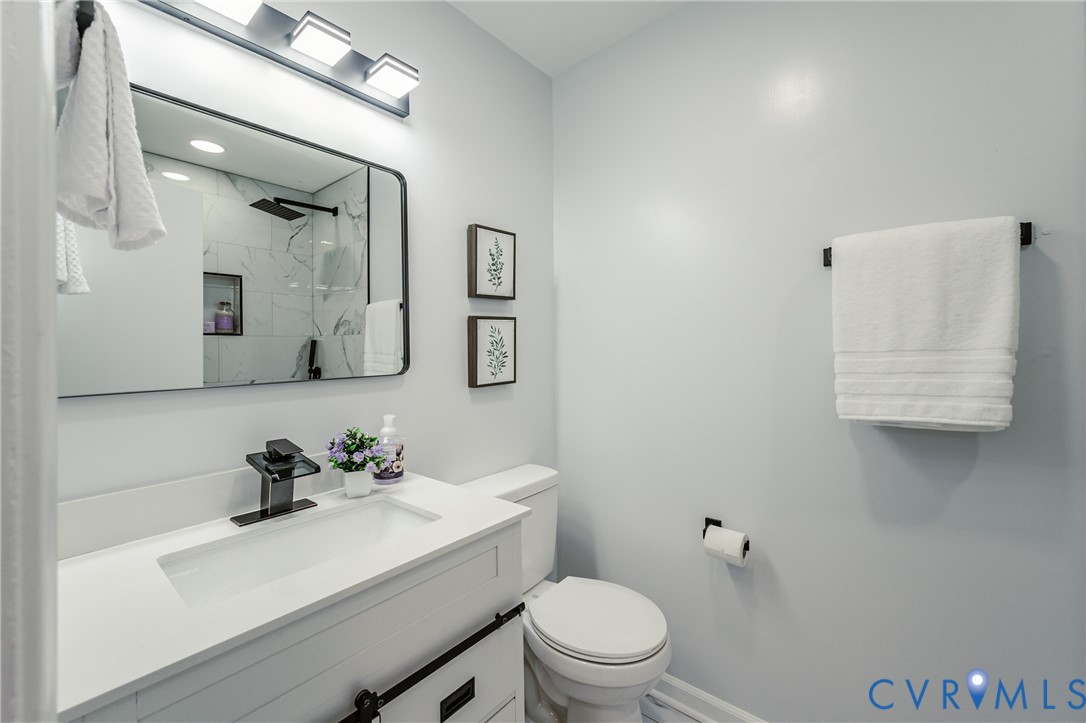 9514 Riddle Road Chesterfield, VA 23832 - Photo 42 of 50 Full bathroom featuring vanity and a marble finish