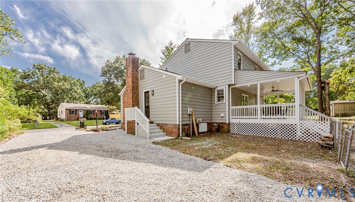 9514 Riddle Road Chesterfield, VA 23832 - Photo 46 of 50 Rear view of house with a ceiling fan, a chimney,