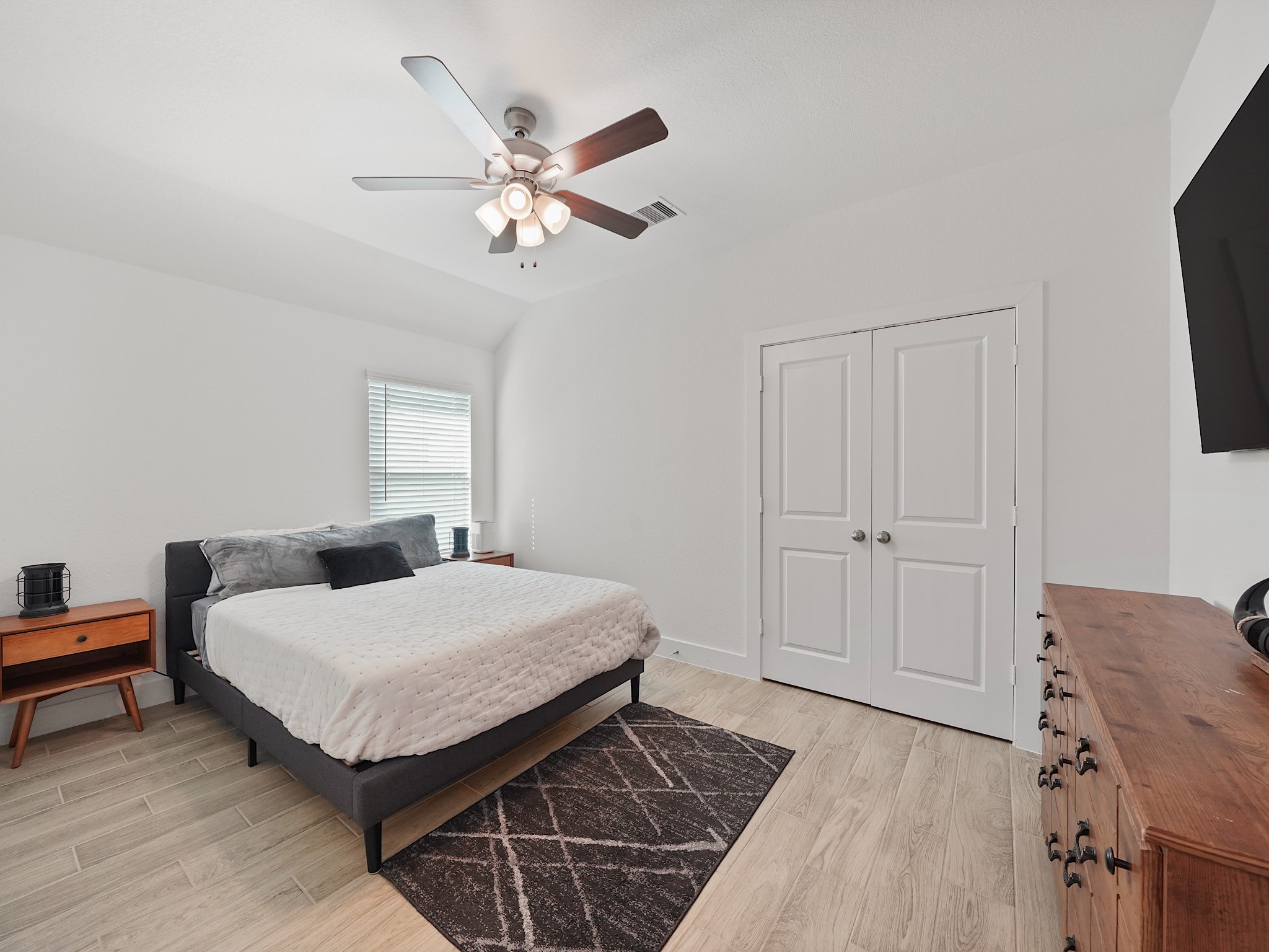 9 Alyssa Palms Drive Manvel, TX 77578 - Photo 15 of 30 a bedroom with a bed and a chandelier