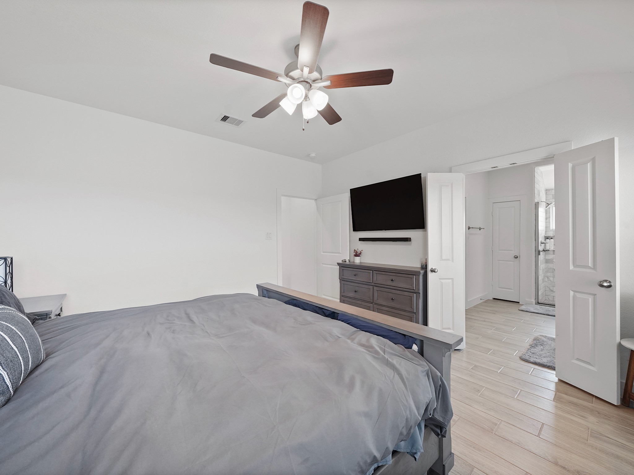 9 Alyssa Palms Drive Manvel, TX 77578 - Photo 20 of 30 a bedroom with a bed and a flat screen tv