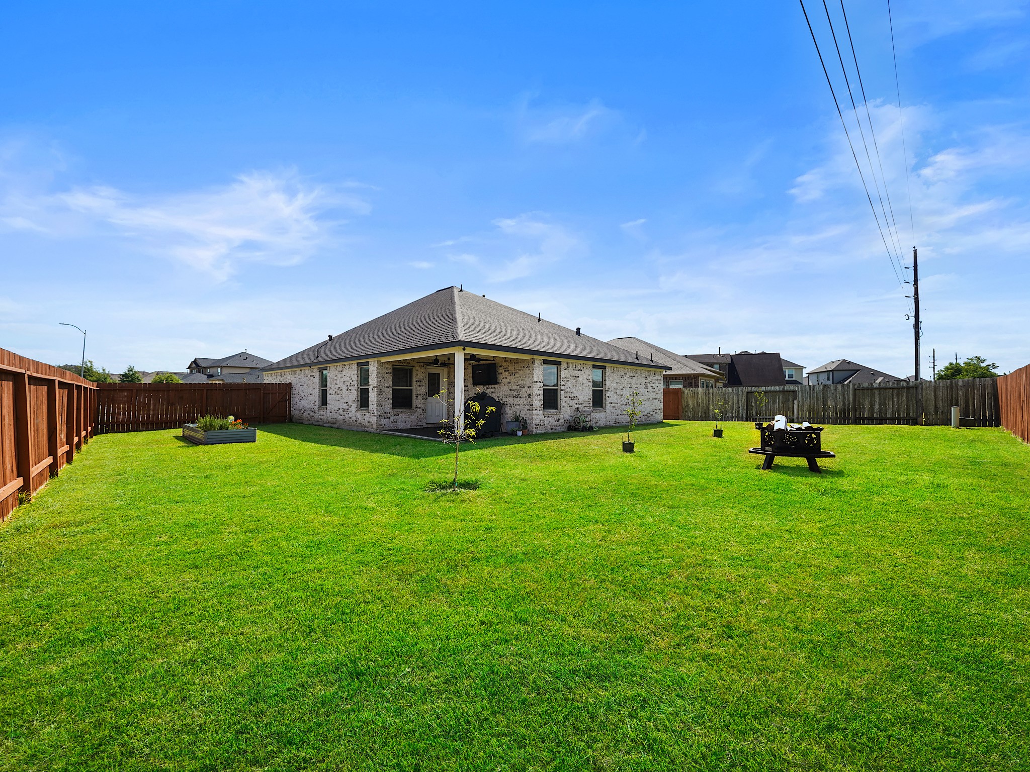 9 Alyssa Palms Drive Manvel, TX 77578 - Photo 28 of 30 a yellow house with a big yard