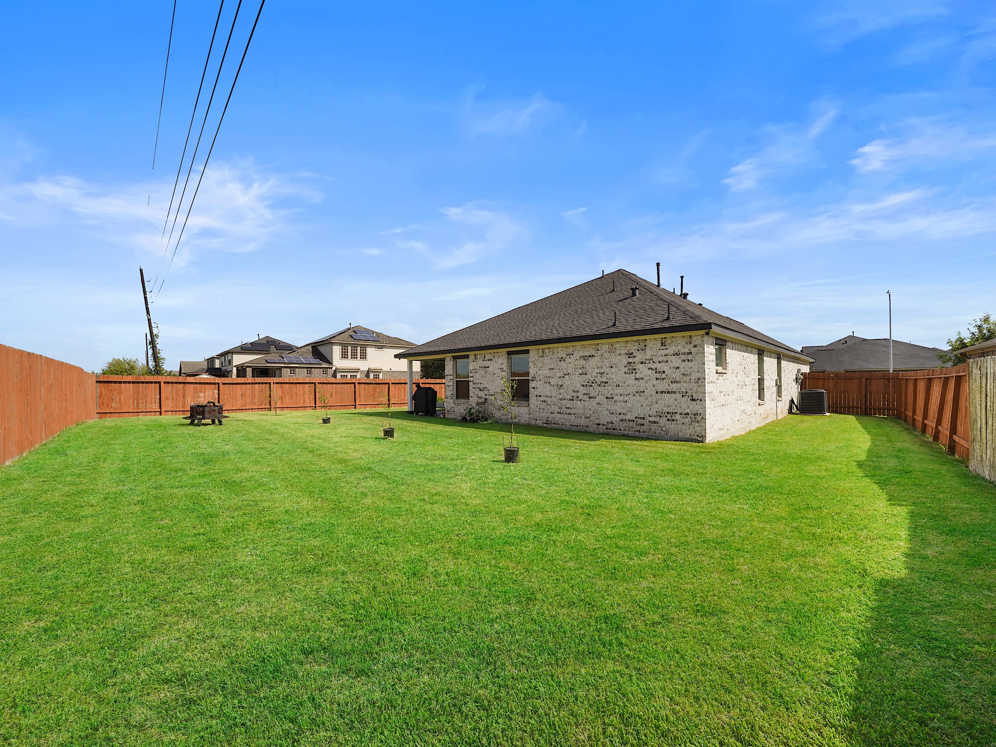9 Alyssa Palms Drive Manvel, TX 77578 - Photo 29 of 30 a view of a house with a big yard and a forest