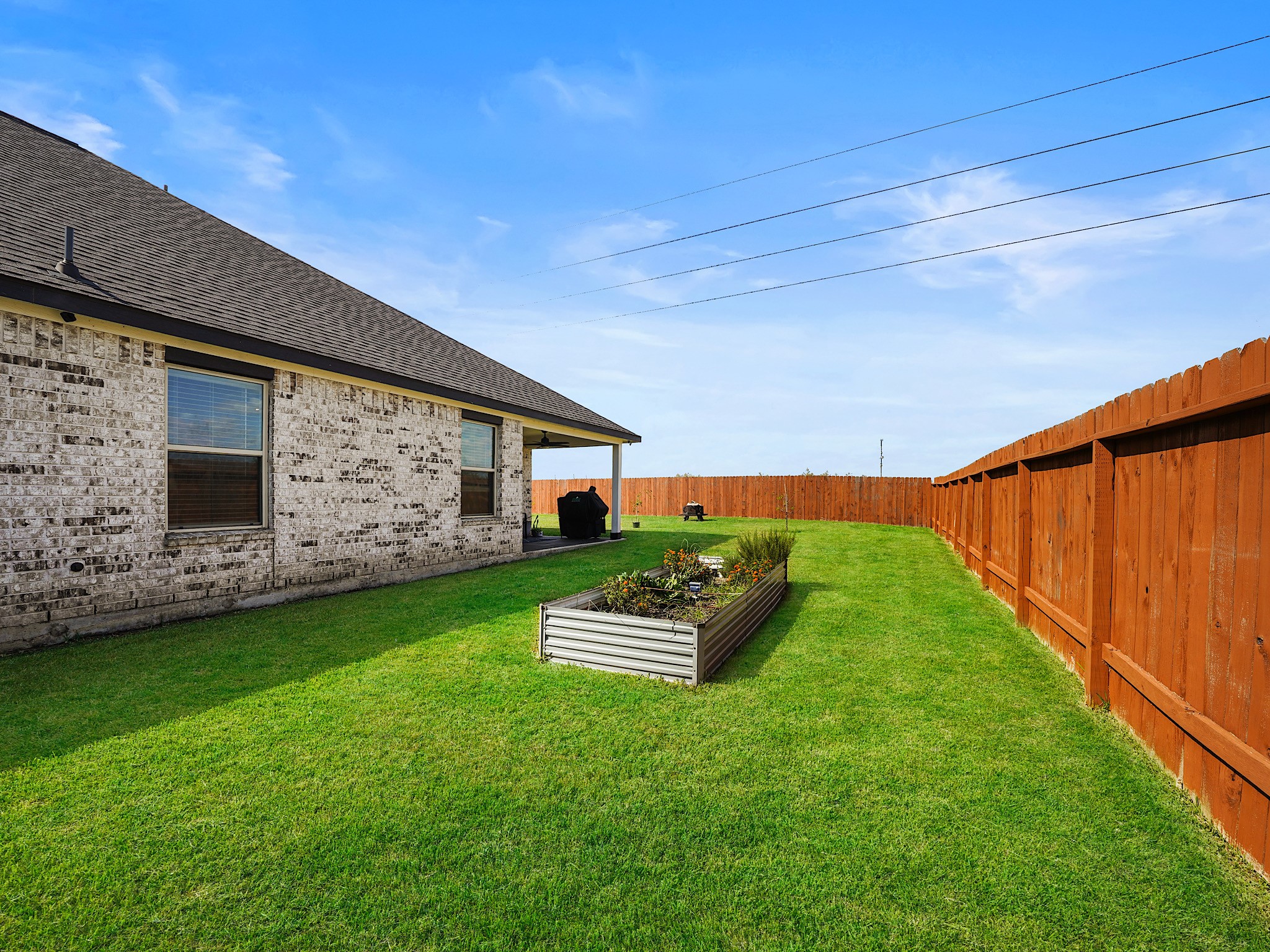 9 Alyssa Palms Drive Manvel, TX 77578 - Photo 30 of 30 a front view of a house with a garden