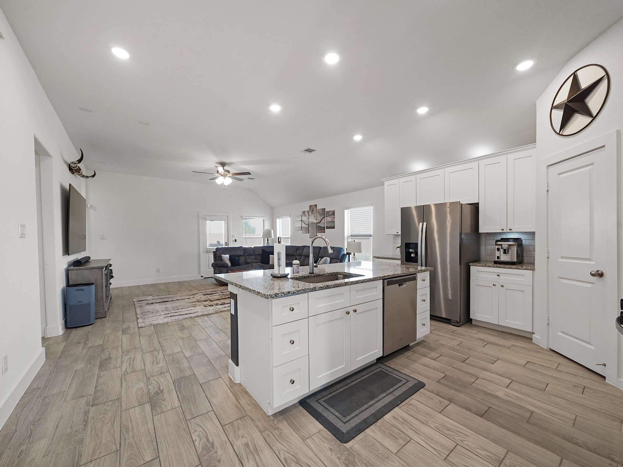 9 Alyssa Palms Drive Manvel, TX 77578 - Photo 5 of 30 a kitchen with stainless steel appliances a refrigerator sink and microwave