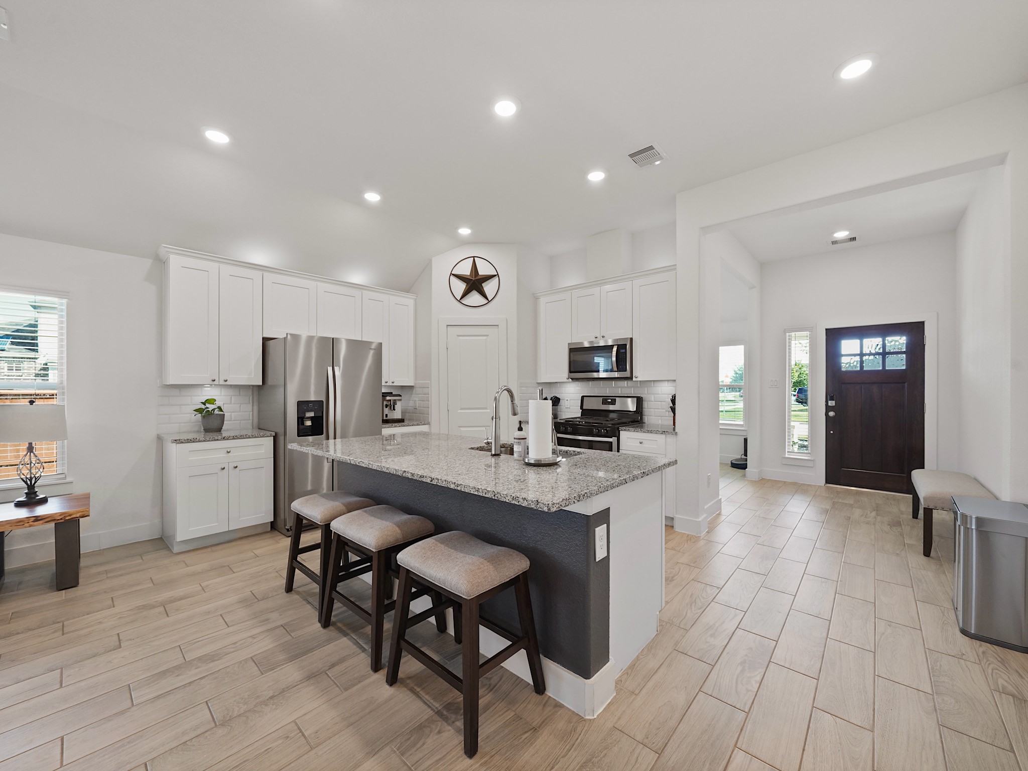 9 Alyssa Palms Drive Manvel, TX 77578 - Photo 6 of 30 a kitchen with stainless steel appliances kitchen island granite countertop a sink and cabinets