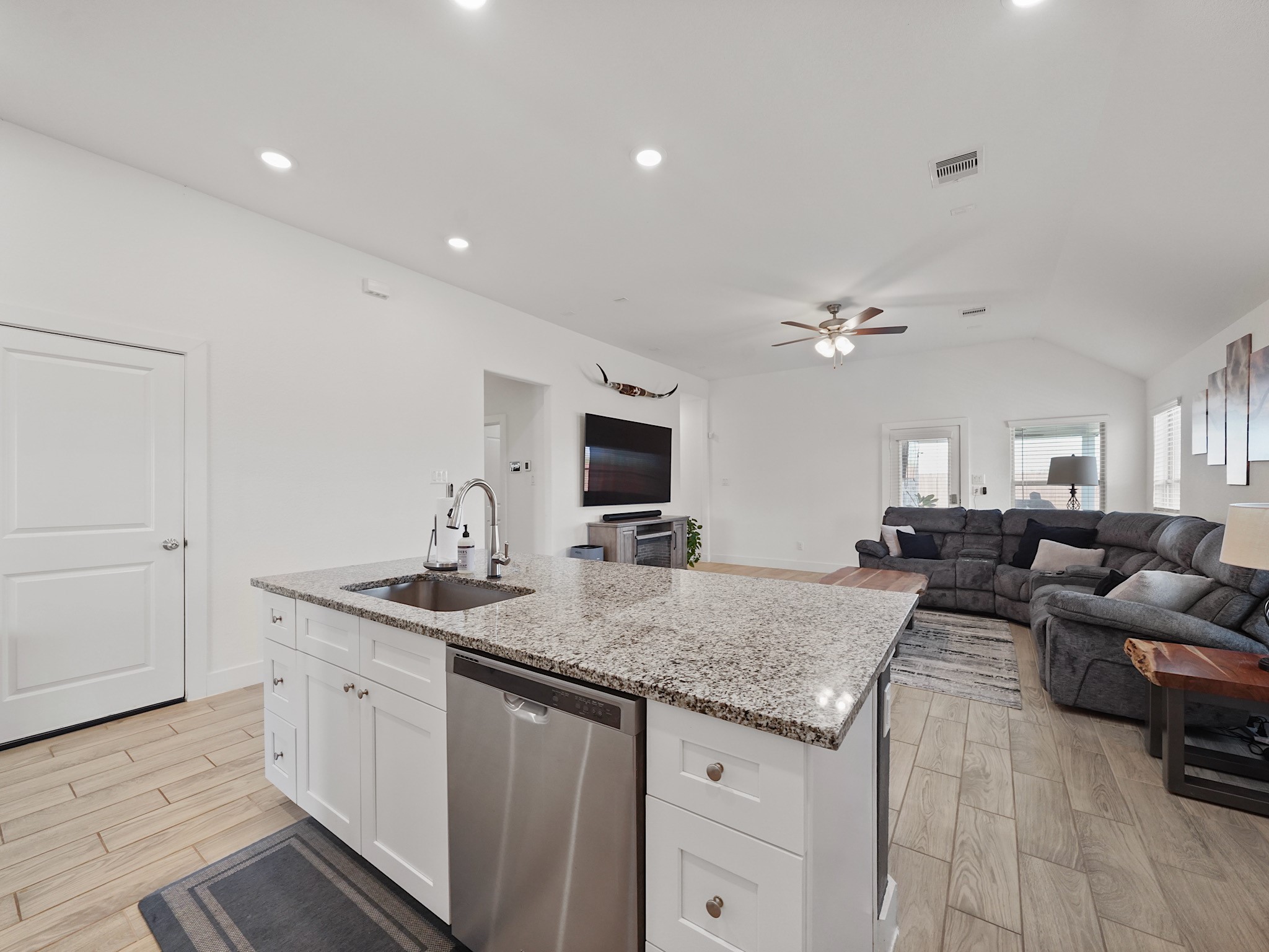 9 Alyssa Palms Drive Manvel, TX 77578 - Photo 9 of 30 a living room with granite countertop furniture and a flat screen tv