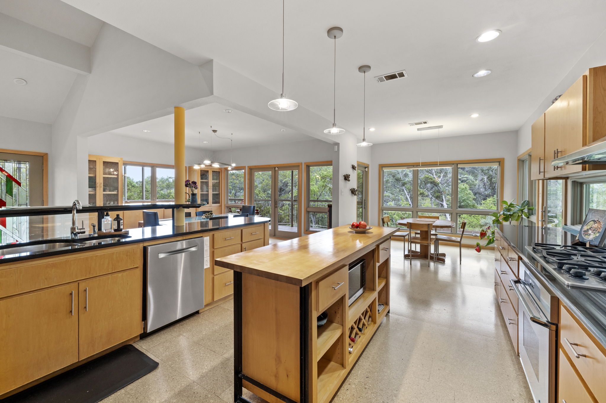 701 Yaupon Valley Road West Lake Hills, TX 78746 - Photo 14 of 40 The island has space for a microwave and wine storage.