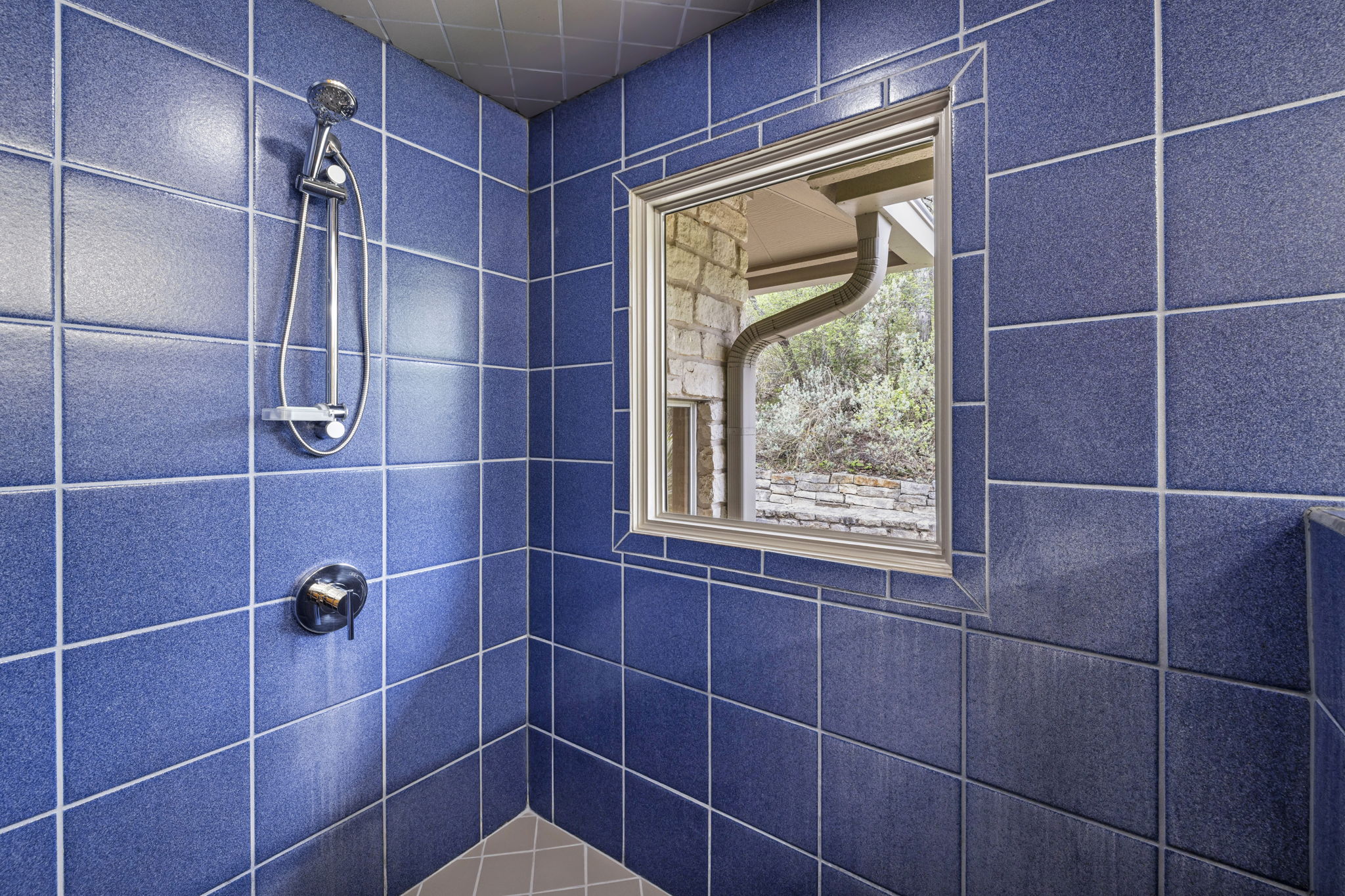 701 Yaupon Valley Road West Lake Hills, TX 78746 - Photo 19 of 40 Large walk-in shower. This window opens to the back of the house; it's very private.