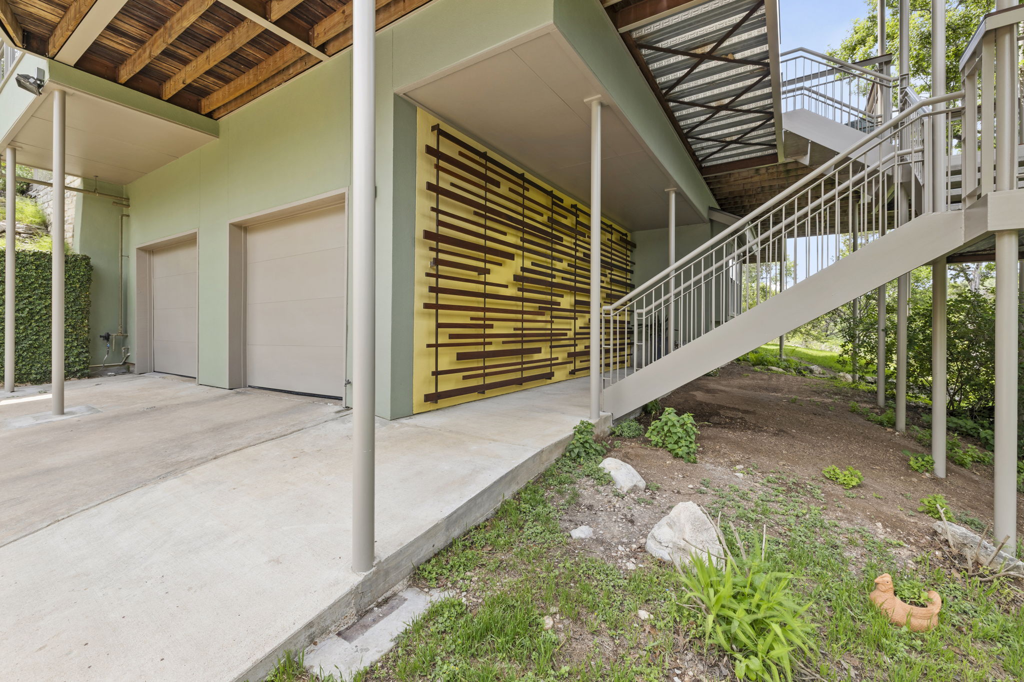 701 Yaupon Valley Road West Lake Hills, TX 78746 - Photo 2 of 40 Colorful accent wall welcomes you upstairs to the front door.