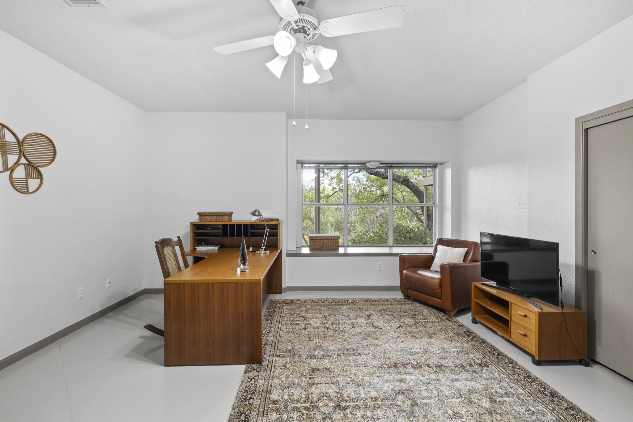 701 Yaupon Valley Road West Lake Hills, TX 78746 - Photo 24 of 40 This secondary bedroom is staged as an office/flex room. On the opposite (unseen) wall, there is a Murphy bed. There is a closet on the right wall.