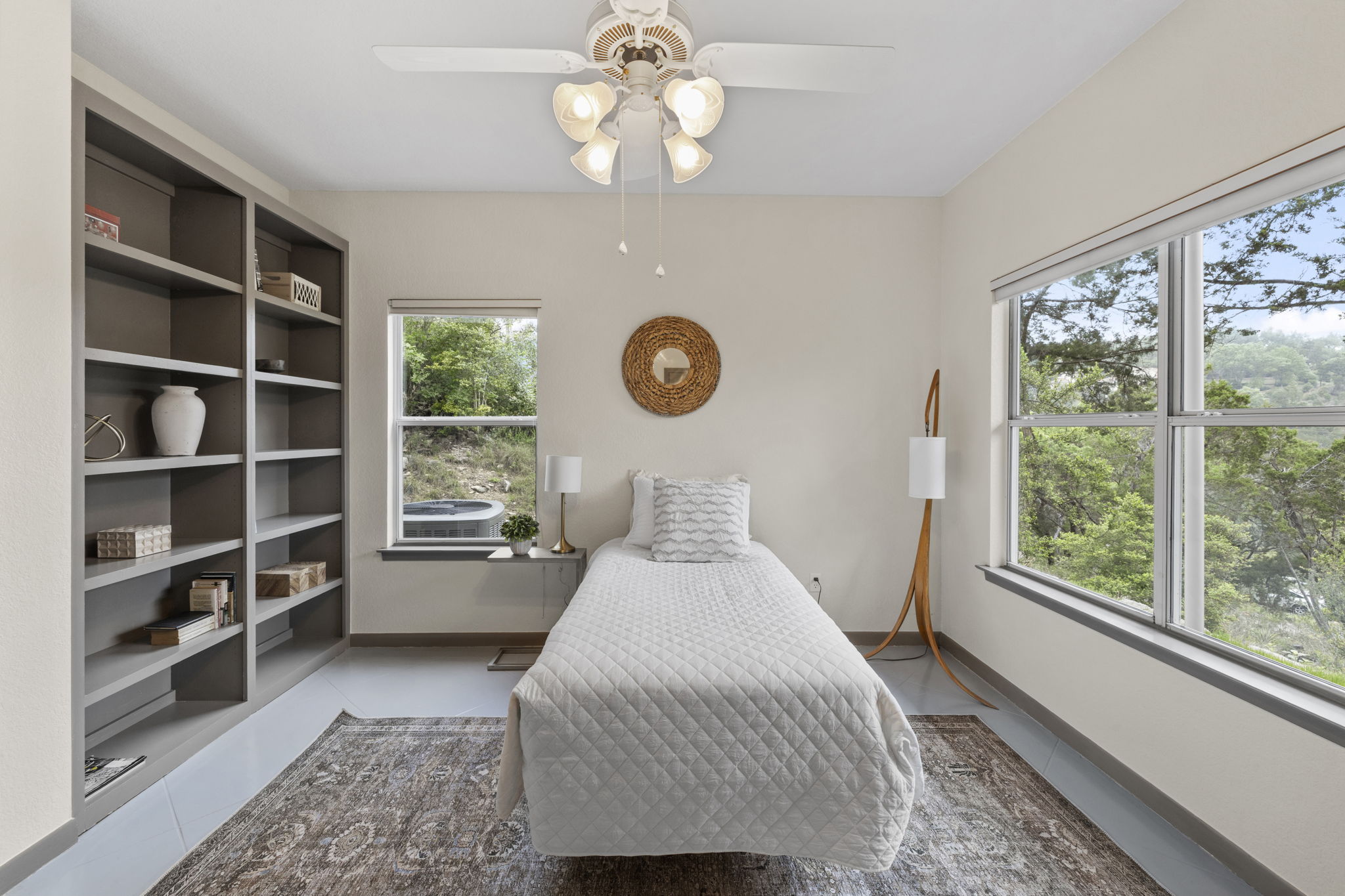 701 Yaupon Valley Road West Lake Hills, TX 78746 - Photo 30 of 40 Secondary bedroom facing the front of the house with built-in bookcases.