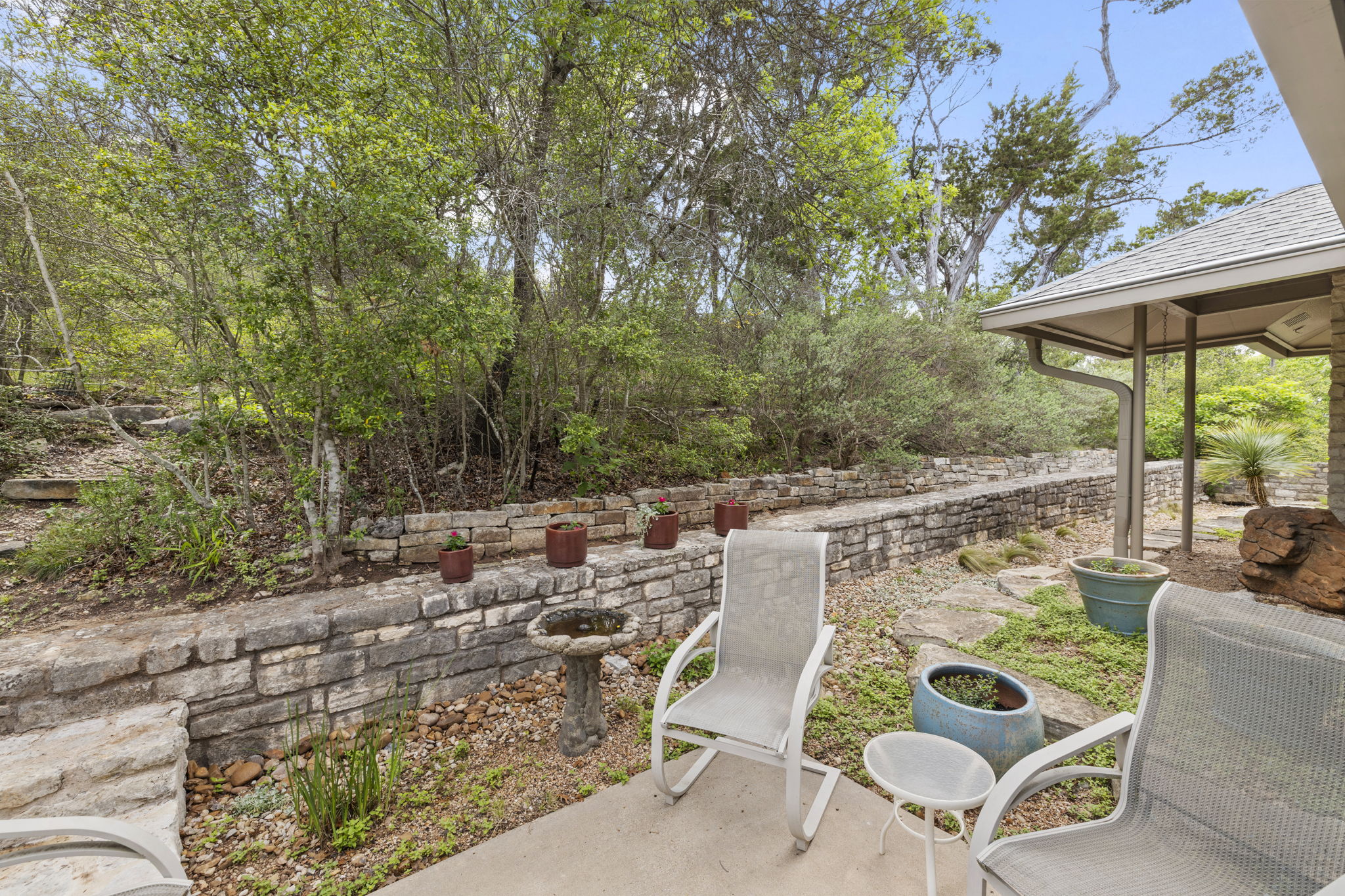701 Yaupon Valley Road West Lake Hills, TX 78746 - Photo 35 of 40 Back patio and retaining wall.