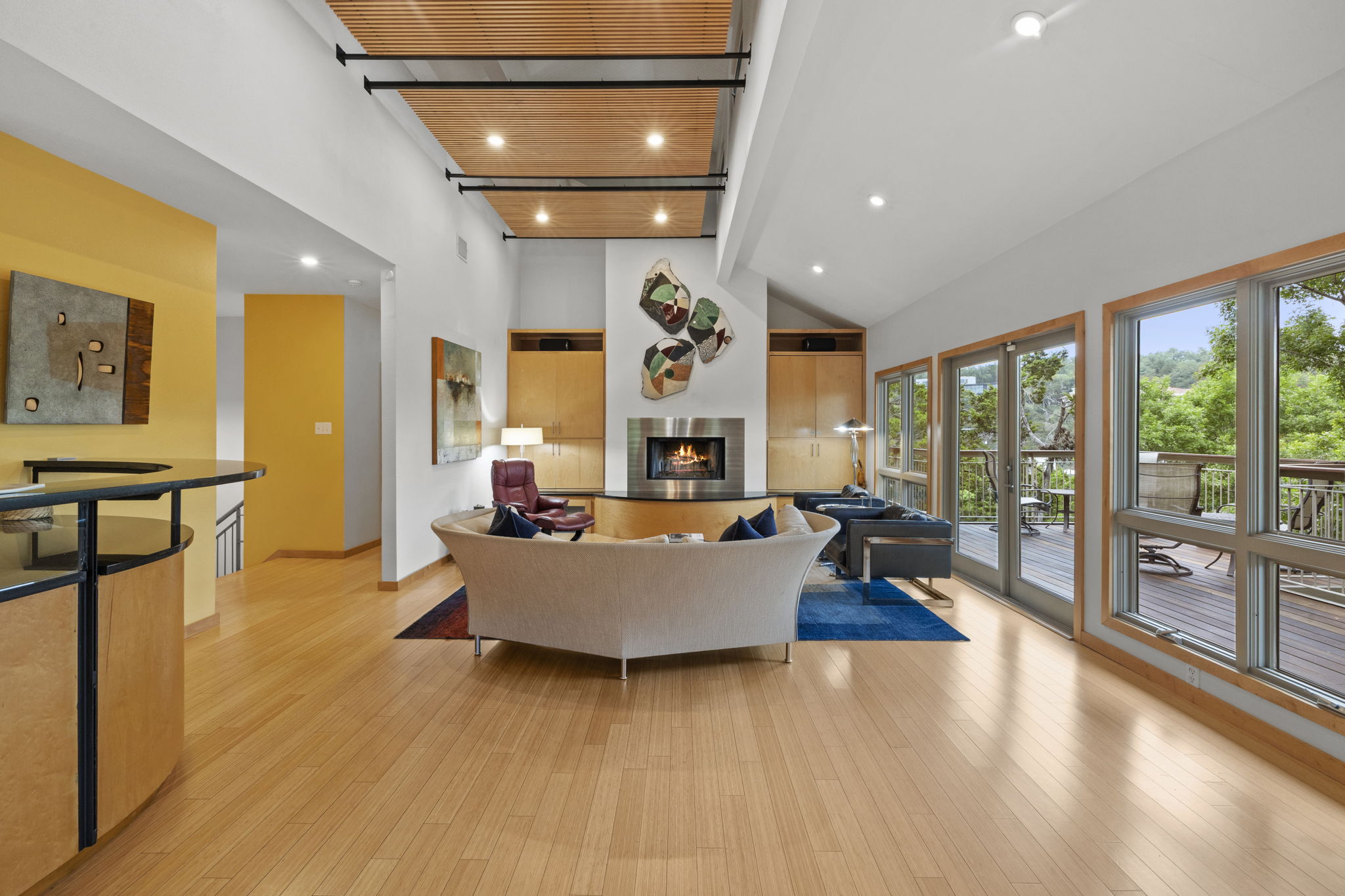 701 Yaupon Valley Road West Lake Hills, TX 78746 - Photo 5 of 40 Wall of windows with doors to the wraparound deck.