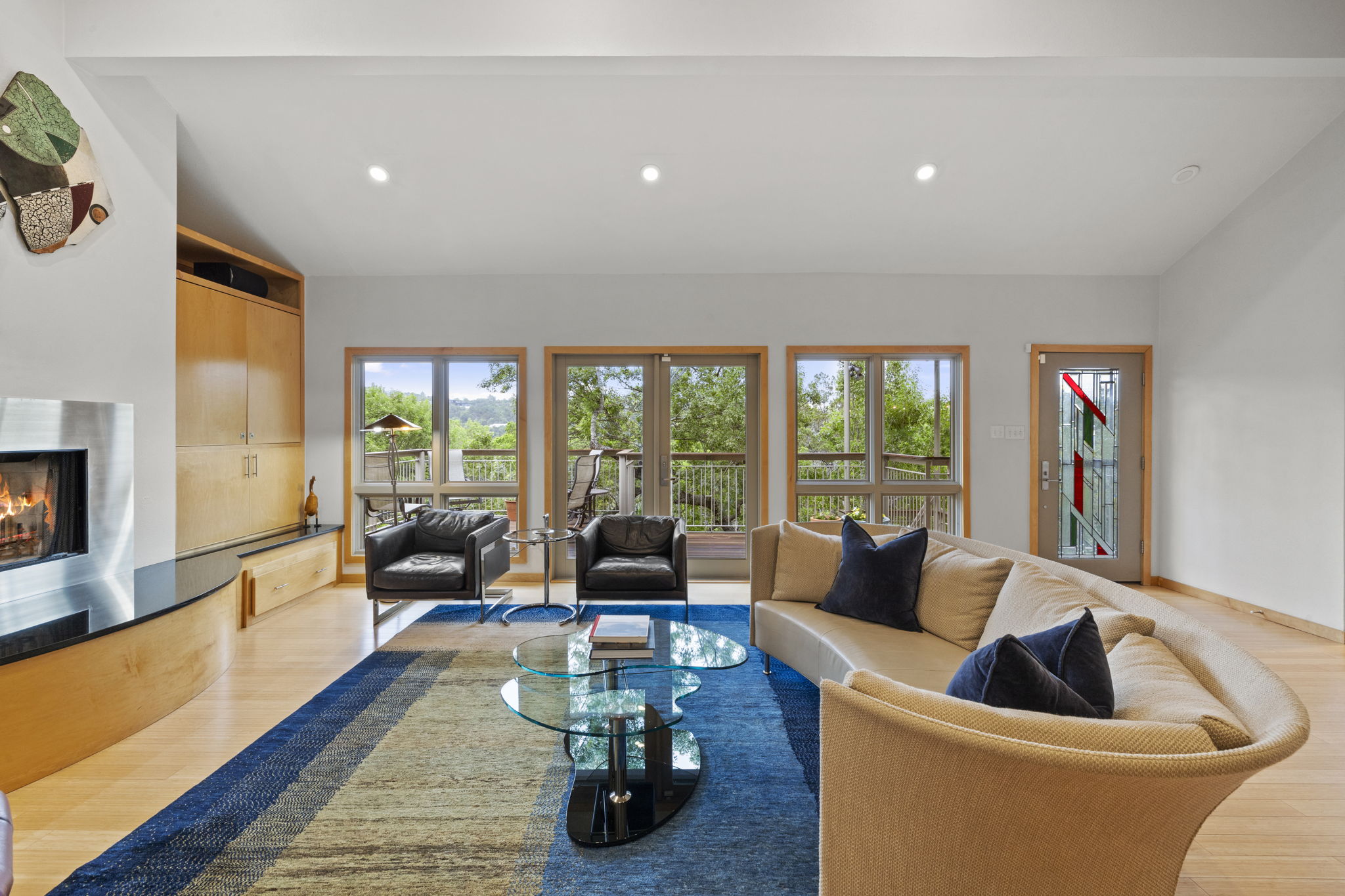 701 Yaupon Valley Road West Lake Hills, TX 78746 - Photo 6 of 40 Custom built-in cabinetry for your TV and stereo surround the fireplace.