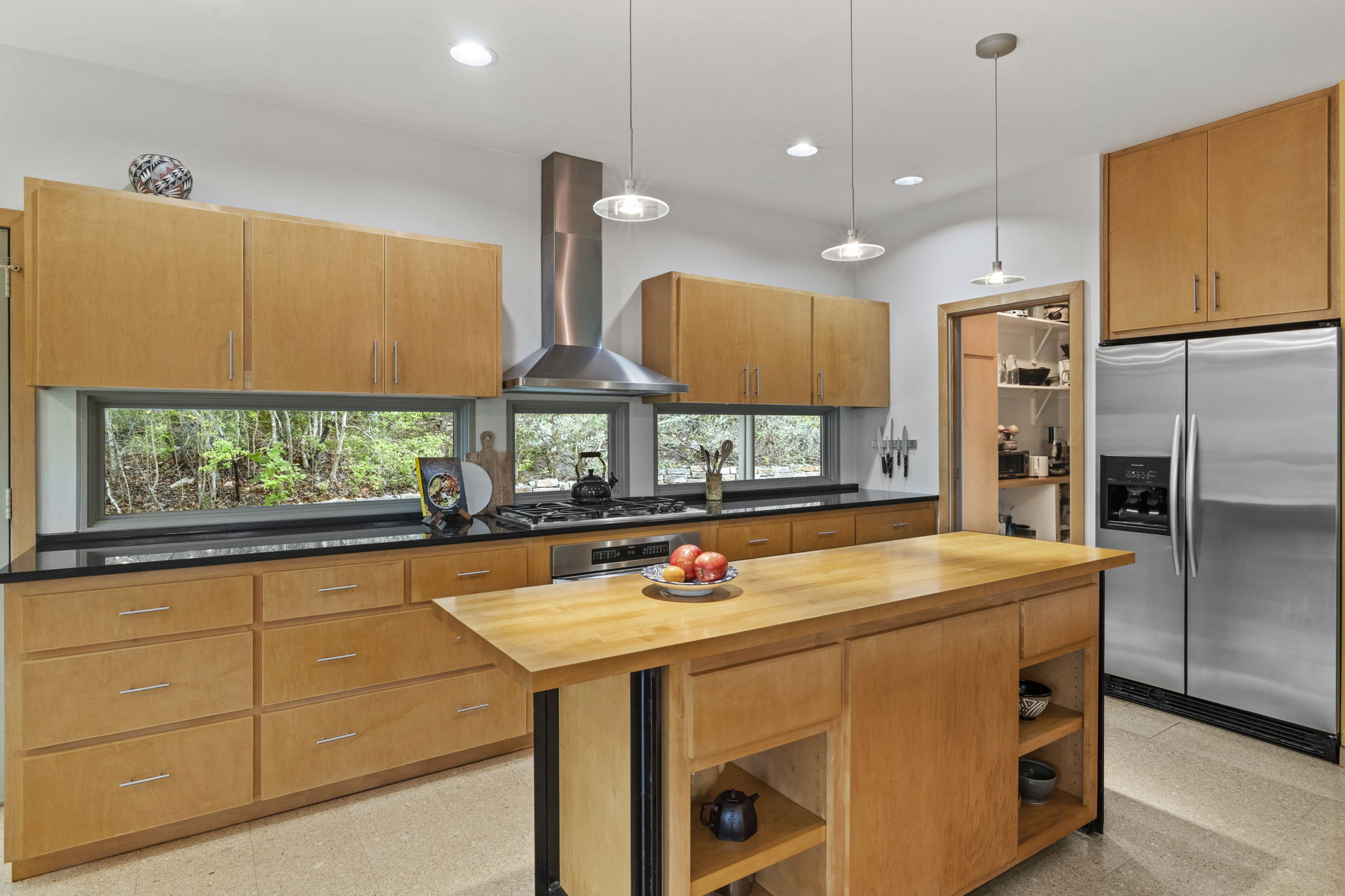 701 Yaupon Valley Road West Lake Hills, TX 78746 - Photo 10 of 40 Remodeled in 2005, this is a chef's kitchen with a view to the outdoors with a gas range and large butcher block island. Refrigerator conveys if desired.