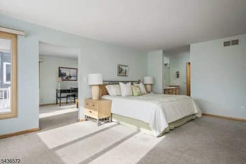 a bathroom with a granite countertop sink a mirror and a
