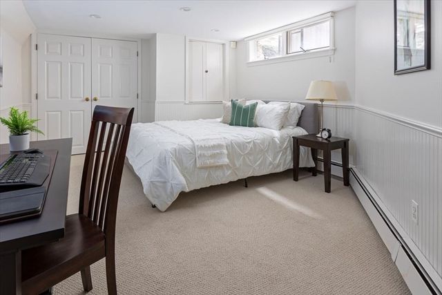 a bedroom with a bed and a table in it