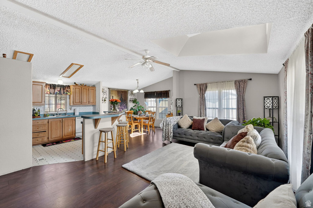 269 Mindella Way, Unit A Layton, UT 84041 - Photo 5 of 37 Living area with dark wood finished floors and a ceiling fan