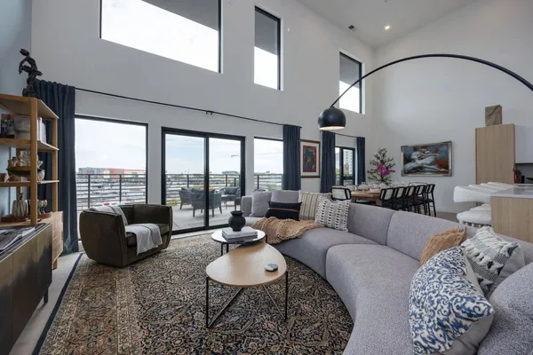 a living room with furniture and a large window