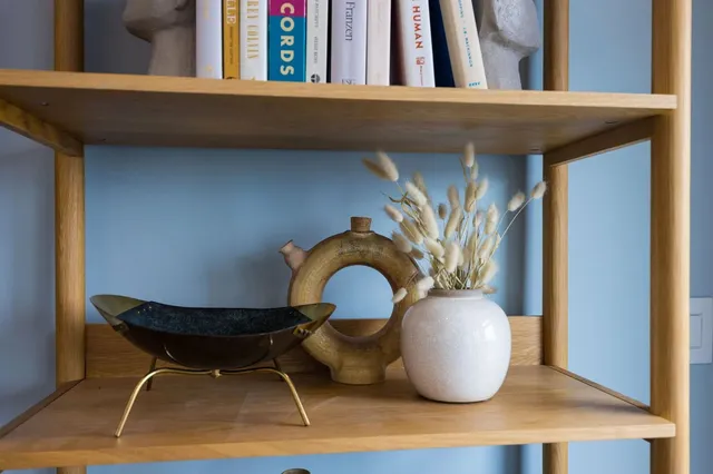 a kitchen with stainless steel appliances granite countertop a sink a stove and white cabinets
