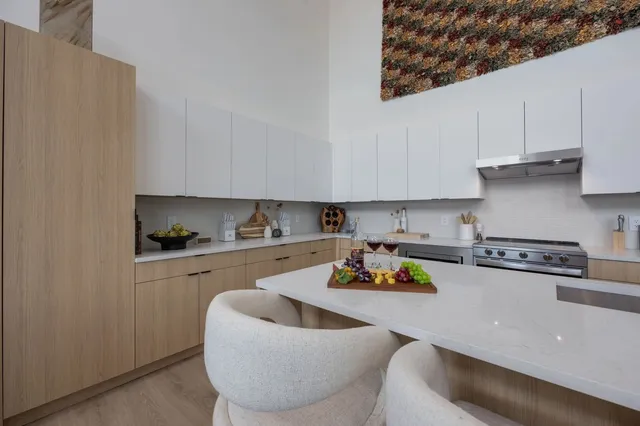 a living room with furniture and flowers