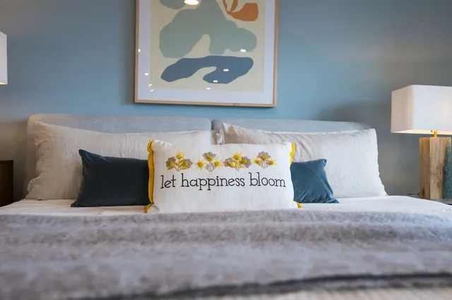 a spacious bathroom with a double vanity sink and mirror