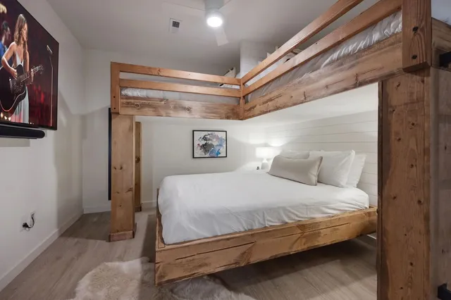 a view of a patio with a table and chairs and potted plants