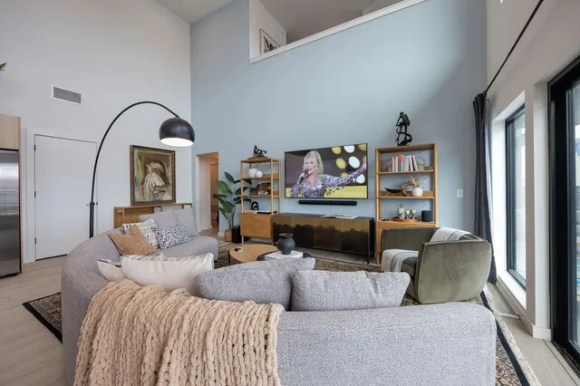 a living room with furniture and a large window