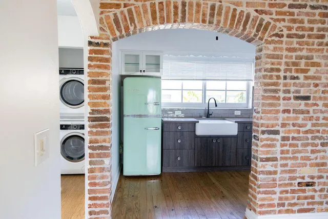 a kitchen with a sink a cabinets and window