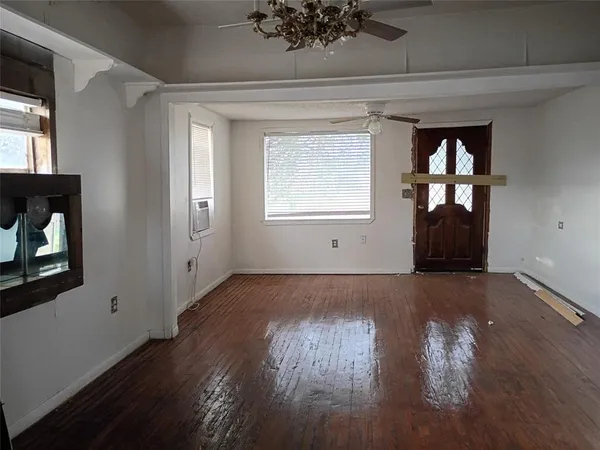 a view of hallway with wooden floor