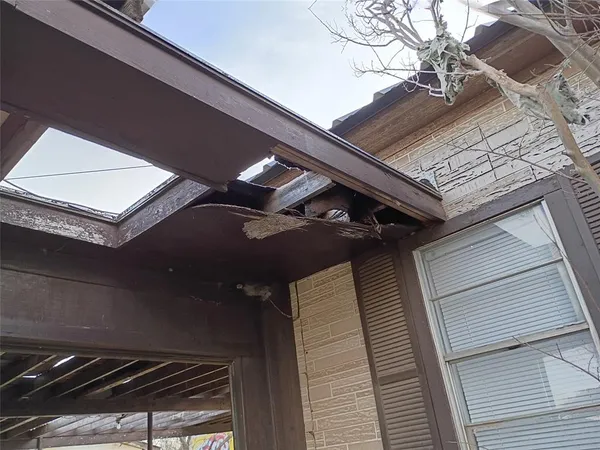 a view of backyard with wooden fence