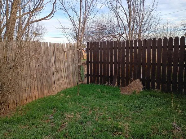 a view of a kitchen with a refrigerator