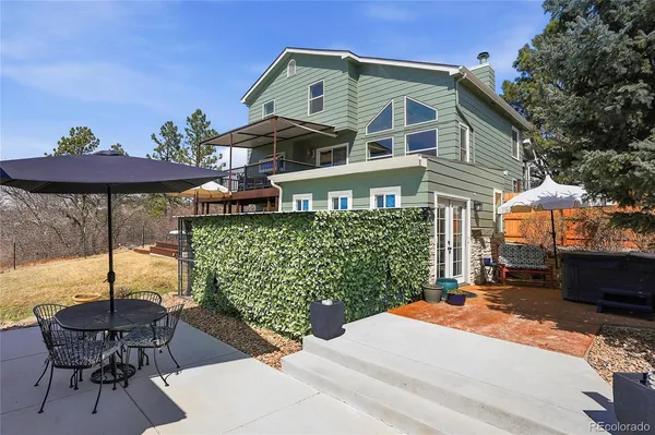 a view of a patio in a backyard