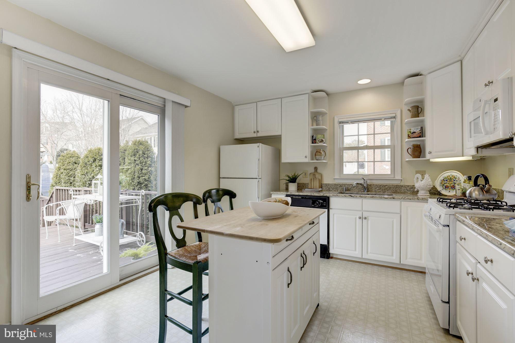 484 Tschiffely Square Road Gaithersburg, MD 20878 - Photo 14 of 27 Kitchen Opens to Rear Deck