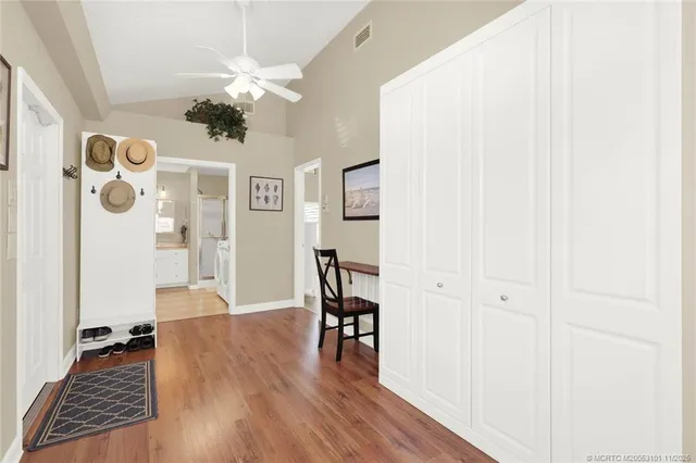 a view of washer and dryer with kitchen in the background