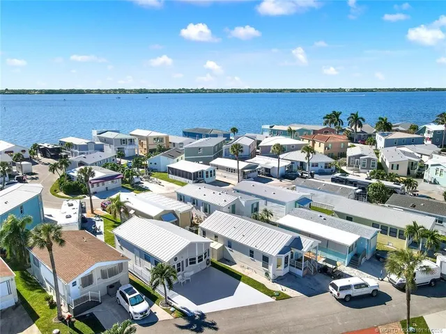 a view of a terrace with lawn chairs