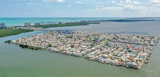 an aerial view of residential houses with outdoor space and street view