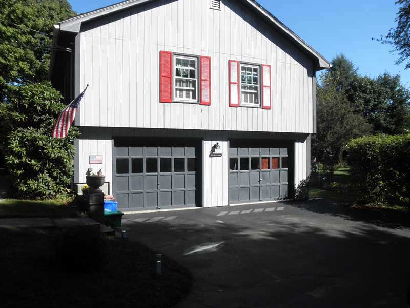 24 Swan Road Smithfield, RI 02917 - Photo 2 of 24 Exterior Front. 2-Car Garage, One Stall Current Used as Workshop & BR, Can Be Converted Back + Parking for 8 Cars!
