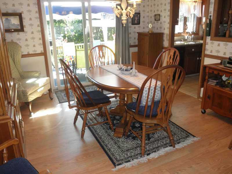 24 Swan Road Smithfield, RI 02917 - Photo 8 of 24 Dining Room. Another View of FDR with Sliders to Deck!