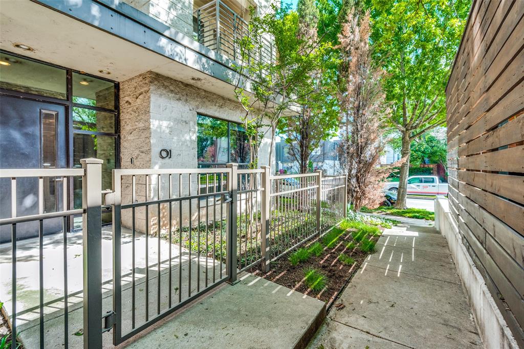 4111 Newton Avenue, Unit 1 Dallas, TX 75219 - Photo 1 of 21 a view of a house with a small yard and large trees