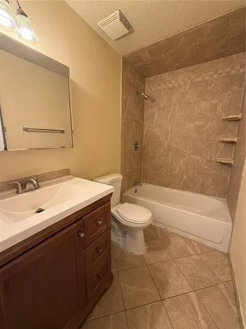 a bathroom with a sink a toilet and a bathtub