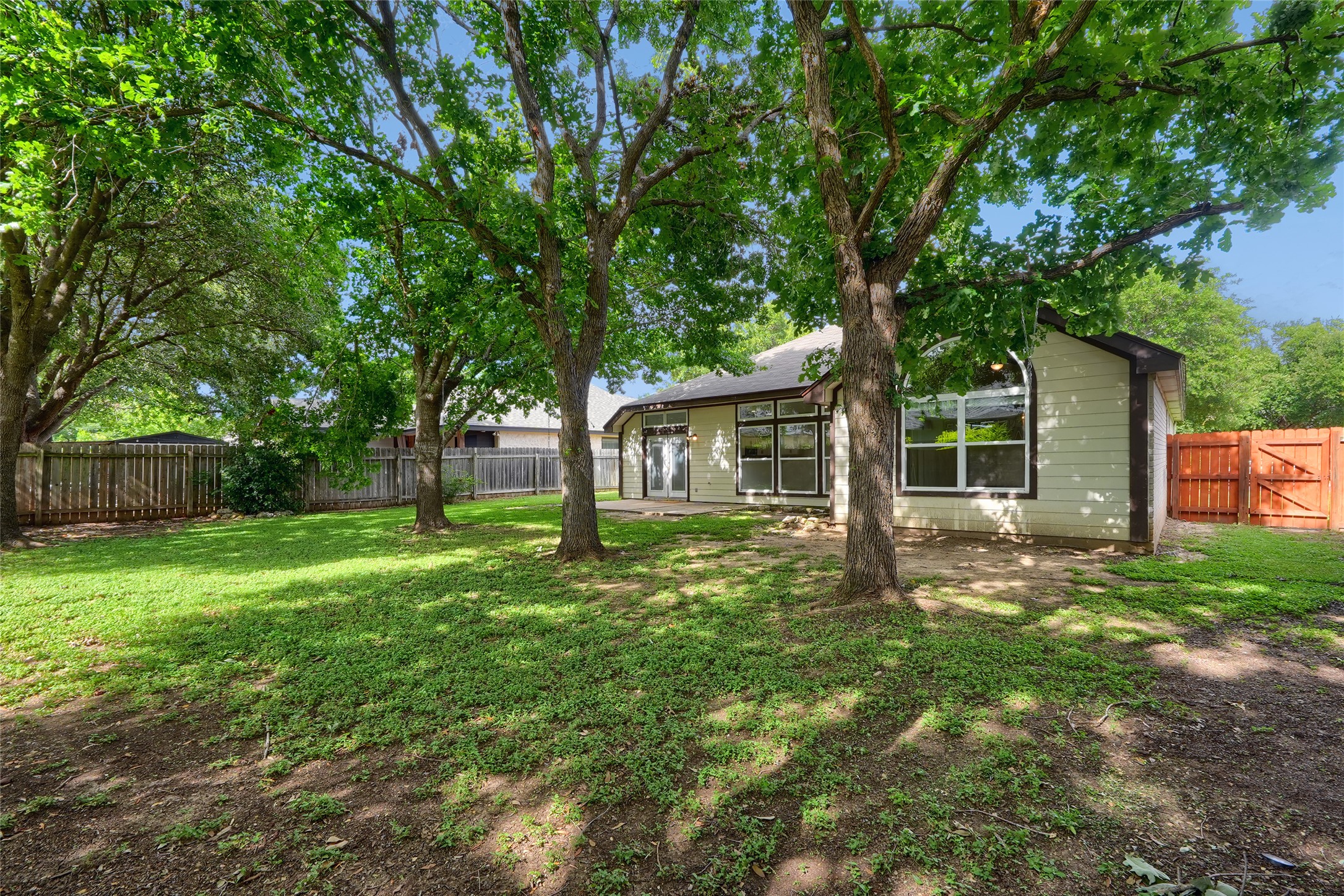 119 Stephen Lane Georgetown, TX 78626 - Photo 16 of 32 A generous backyard offers a private retreat, fenced with new gate, ample shaded green space and a patio area.